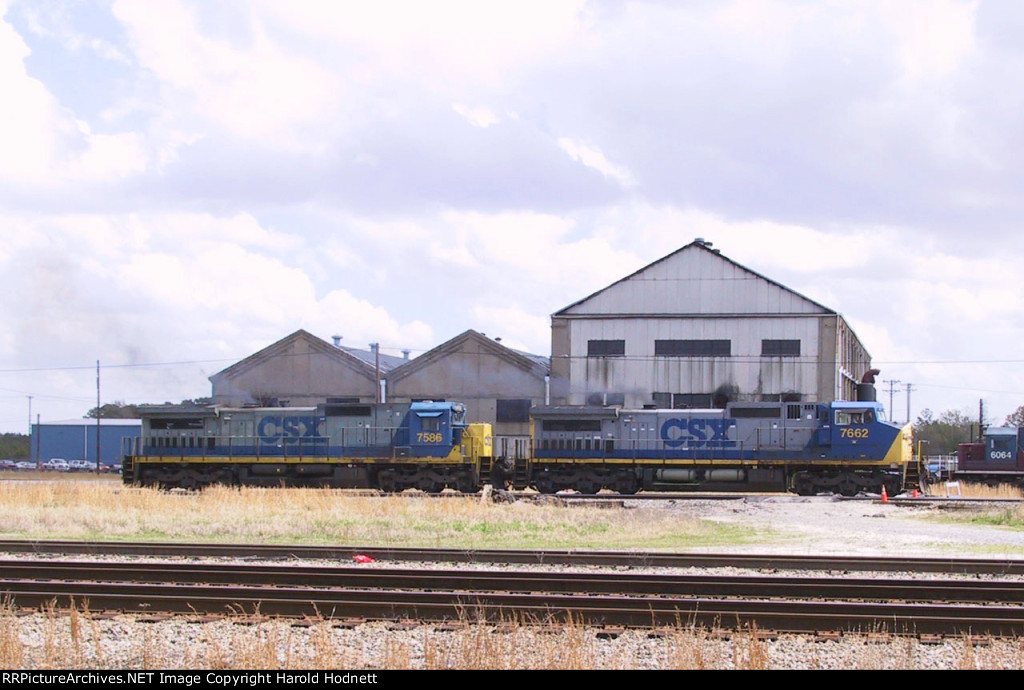 CSX 7662 & 7586 pass the Emerson Shops